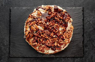 birthday cake with nuts on a stone background