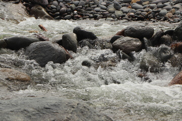 Heddon river flowing through the valley and over rocky ground