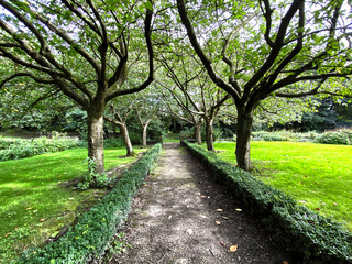 Fototapeta na wymiar Parkland with trees, and lawns near, Bolling Hall in, Bradford, Yorkshire, UK