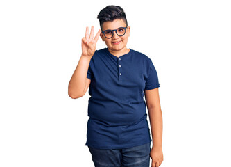 Little boy kid wearing casual clothes and glasses showing and pointing up with fingers number three while smiling confident and happy.