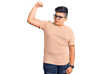 Fototapeta premium Little boy kid wearing casual clothes and glasses strong person showing arm muscle, confident and proud of power