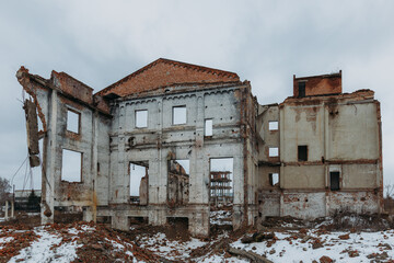 Remains of demolished old industrial building. Pile of stones, bricks and debris