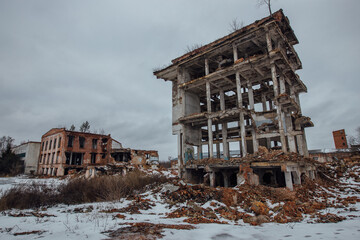 Remains of demolished old industrial building. Pile of stones, bricks and debris