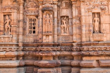 Ancient sculptures on iconic rock temples of Pattadakal, Karnataka, India.
