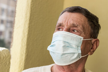 Senior man wearing medical facemask 
