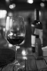 Close up wine glass with wine on the table with dinner set in the restaurant