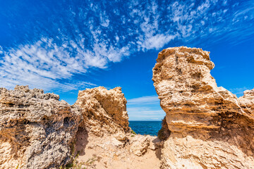 Fototapeta na wymiar Rocky limestone formations on the coast and beaches of Point Peron