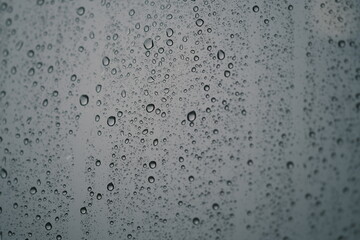 Waterdrop on glass. Water droplets on glass background. Royalty high-quality stock photo image of water drops texture abstract. Wet water on glass background. Close up of bubble pattern rain concept