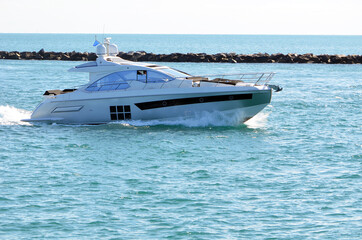 Well appointed cabin cruiser on Government Cut approaching the Port of Miami.
