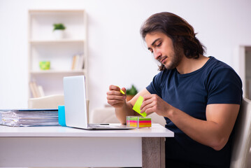 Young man employee working from house