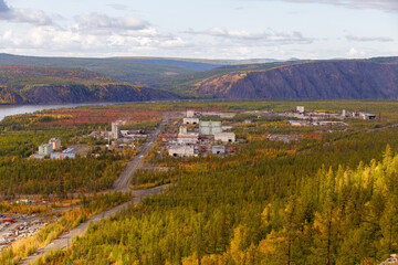 Production buildings of the plant in the north of Russia among the tundra and mountains