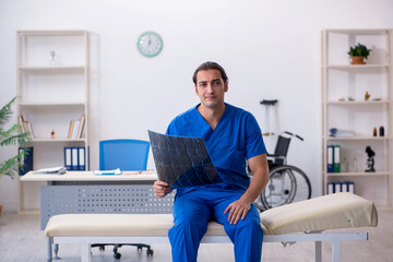 Young male doctor radiologist working in the clinic