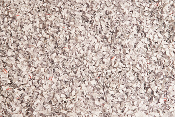 Documents shredded using a microcut for added security. Background for office, security or recycle.