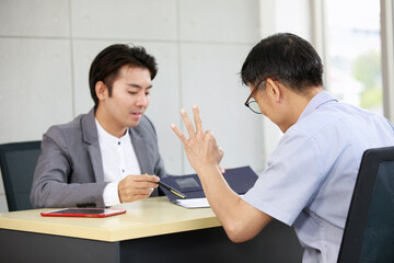 Senior man Agreed to the proposal about family financial planning from professional financial...