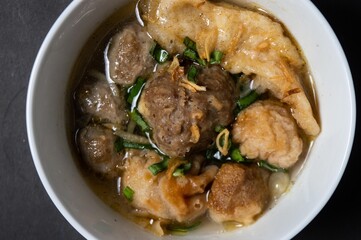 Cuanki is one of the typical snacks of Bandung, West Java, which is a meatball complete with tofu and noodles. Usually Cuanki is sold by traveling merchants by carried 