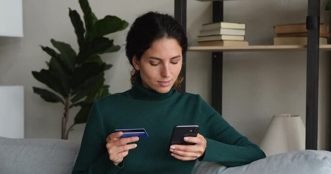 Woman try to pay through e-bank app on cell experiences problems due blocked, card limit, not activated for online payment. Fraud and scam, insufficient lack of funds, unsuccessful transaction concept