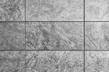Natural grey granite texture tile wall, gray travertine marble, rock surface background. Grunge abstract backdrop. Stone concrete pattern
