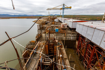 Construction of a river dam across the Kolyma River in Russia