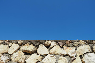old fashioned rock wall with large rocks close up of rock wall close up of detailed rough surface , which ideal for use in the design