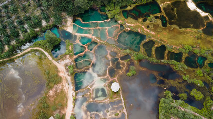 Aerial top down view of beautiful nature abstract crystal clear emarald pool during sunrise