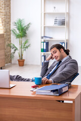 Young male employee working in the office