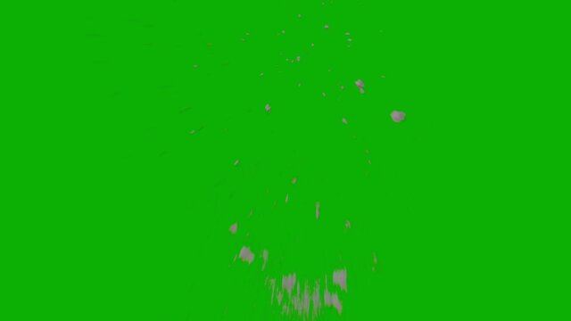 Dusty bullet hits on a wall with chunks of debris flying out . Powder explosion on black background. Impact dust particles. Green screen background front close up