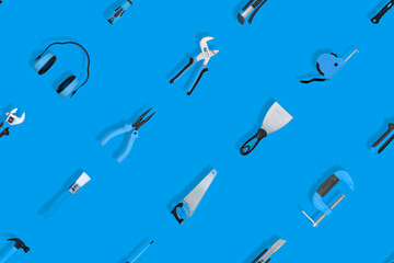 Tools seamless pattern. Various construction tools on a blue background.