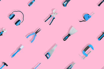 Tools seamless pattern. Various construction tools on a pink background.