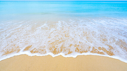 Beautiful sea summer or beach and tropical sea background,soft turquoise ocean wave crashing on sandy shore in summer season sunny day,Nature and travel background concept