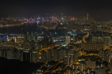 Victoria Harbour as seen from the top of Kowloon peak with Hong Kong Island and Kowloon skyline visible in the distance