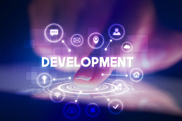 Finger touching tablet with web technology icons and DEVELOPMENT inscription, web technology concept