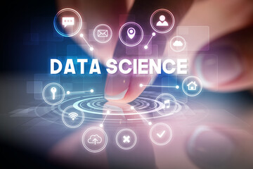 Finger touching tablet with web technology icons and DATA SCIENCE inscription, web technology concept