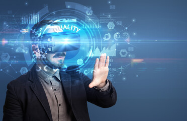 Businessman looking through Virtual Reality glasses with QUALITY inscription, innovative technology concept