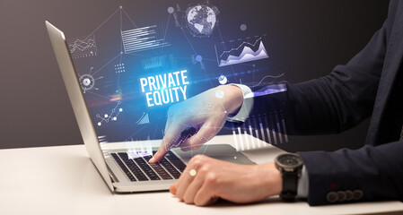 Businessman working on laptop with PRIVATE EQUITY inscription, new business concept