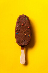 chocolate ice cream on the yellow background