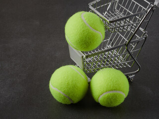 Sport and healthy lifestyle. Tennis. Yellow ball for tennis and a racket on table. Sports background with tennis concept.