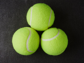 Sport and healthy lifestyle. Tennis. Yellow ball for tennis and a racket on table. Sports background with tennis concept.