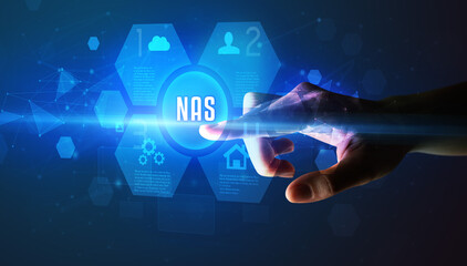 Hand touching NAS inscription, new technology concept