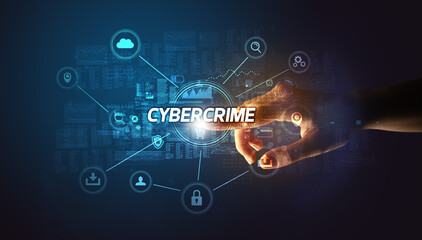 Hand touching CYBERCRIME inscription, Cybersecurity concept