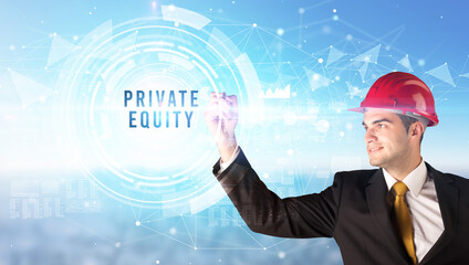 Handsome businessman with helmet drawing PRIVATE EQUITY inscription, contruction business concept