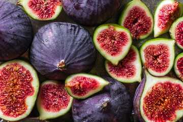 Fresh fig fruits. Whole and sliced figs on dark background.