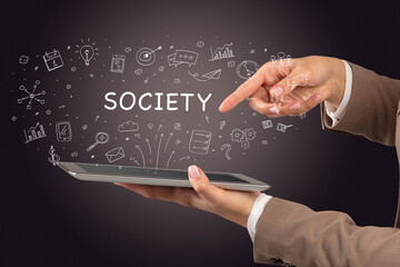 Close-up of a touchscreen with SOCIETY inscription, social media concept