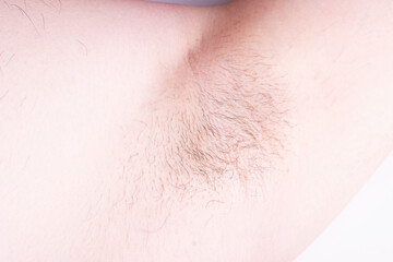male hairy armpit close-up. body care, men's hair removal of intimate places