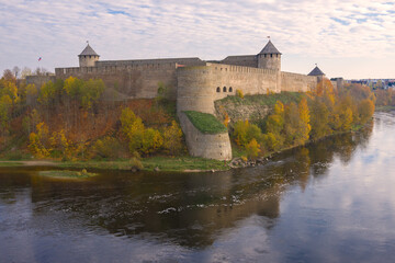 Fototapeta na wymiar Ivangorod fortress on cloudy October morning. Russia
