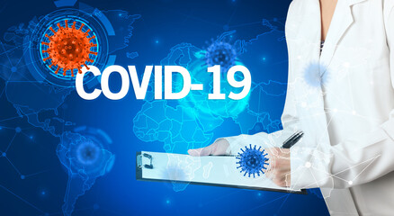 Doctor fills out medical record with COVID-19 inscription, virology concept