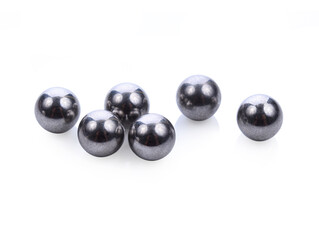 Metallic bearing balls on white background