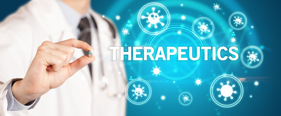 Obraz premium Doctor giving pill with THERAPEUTICS inscription, coronavirus concept