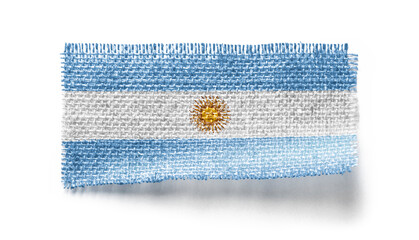 Argentina flag on a piece of cloth on a white background