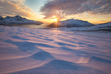 Sunshine over the frozen snowy landscape of arctic Norway