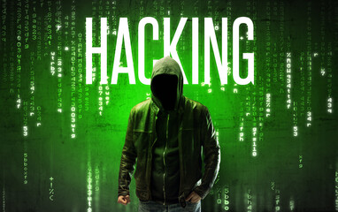 Faceless hacker with HACKING inscription, hacking concept